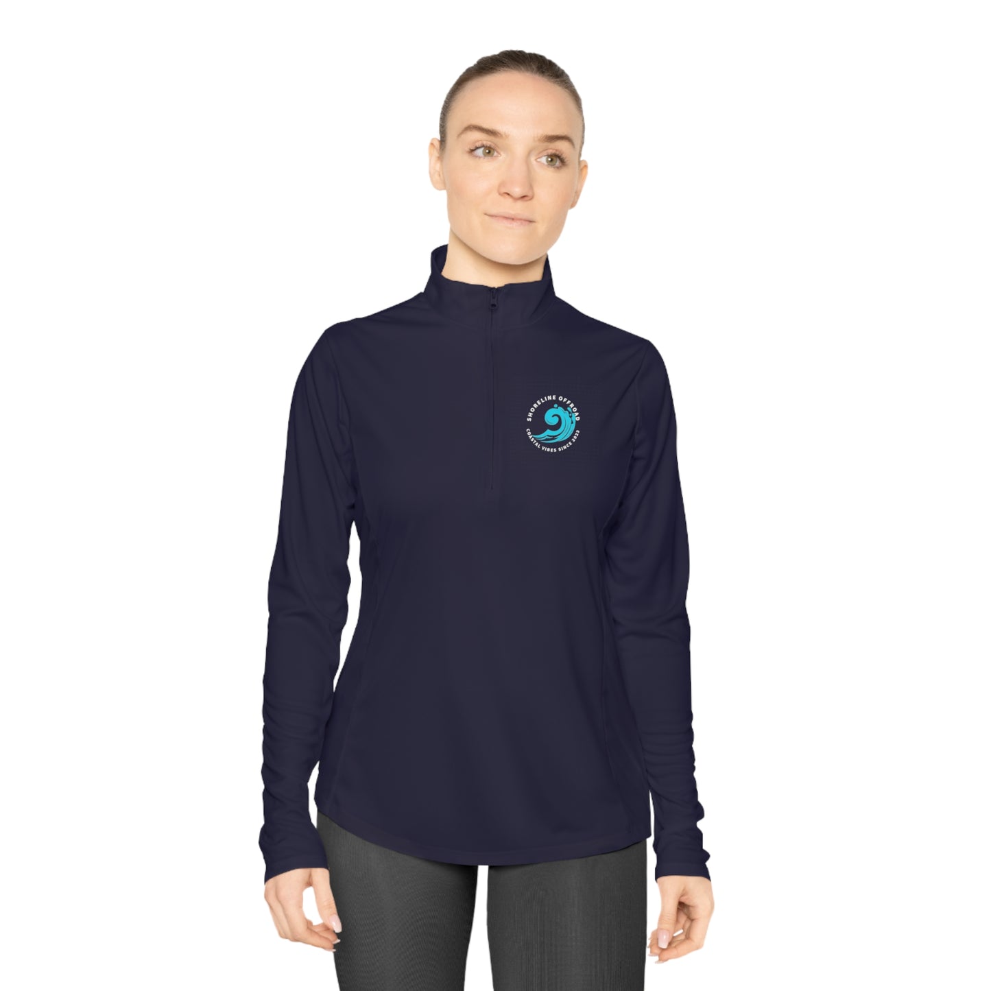 a woman wearing a dark blue shirt with a blue logo on it