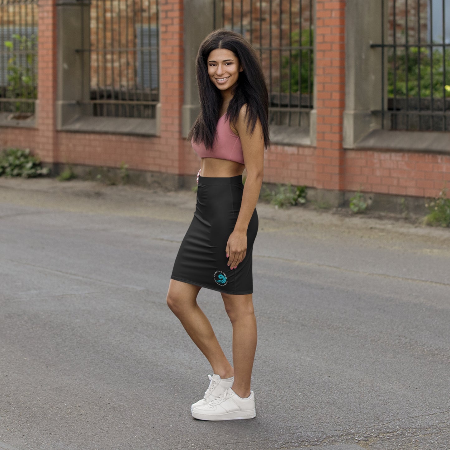 a woman standing in the middle of a street