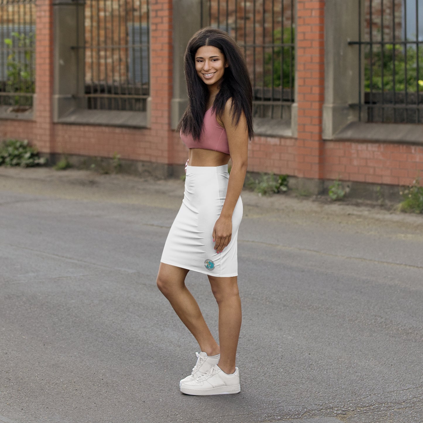 a woman standing in the middle of a street