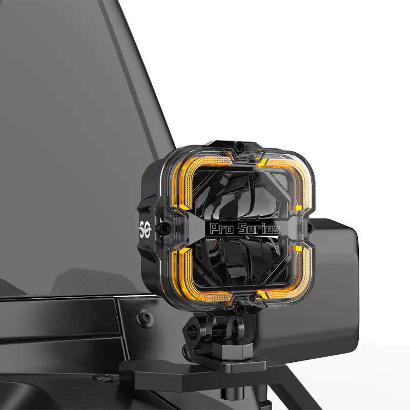 Profile image of the Shoreline Offroad Pro Series Bright White LED 4” Pods with Amber DRL, emphasizing the sturdy build and innovative features that make them top-tier offroad lights. These Bright white pod lights serve as powerful ditch lights and effective rock lights for any adventure.