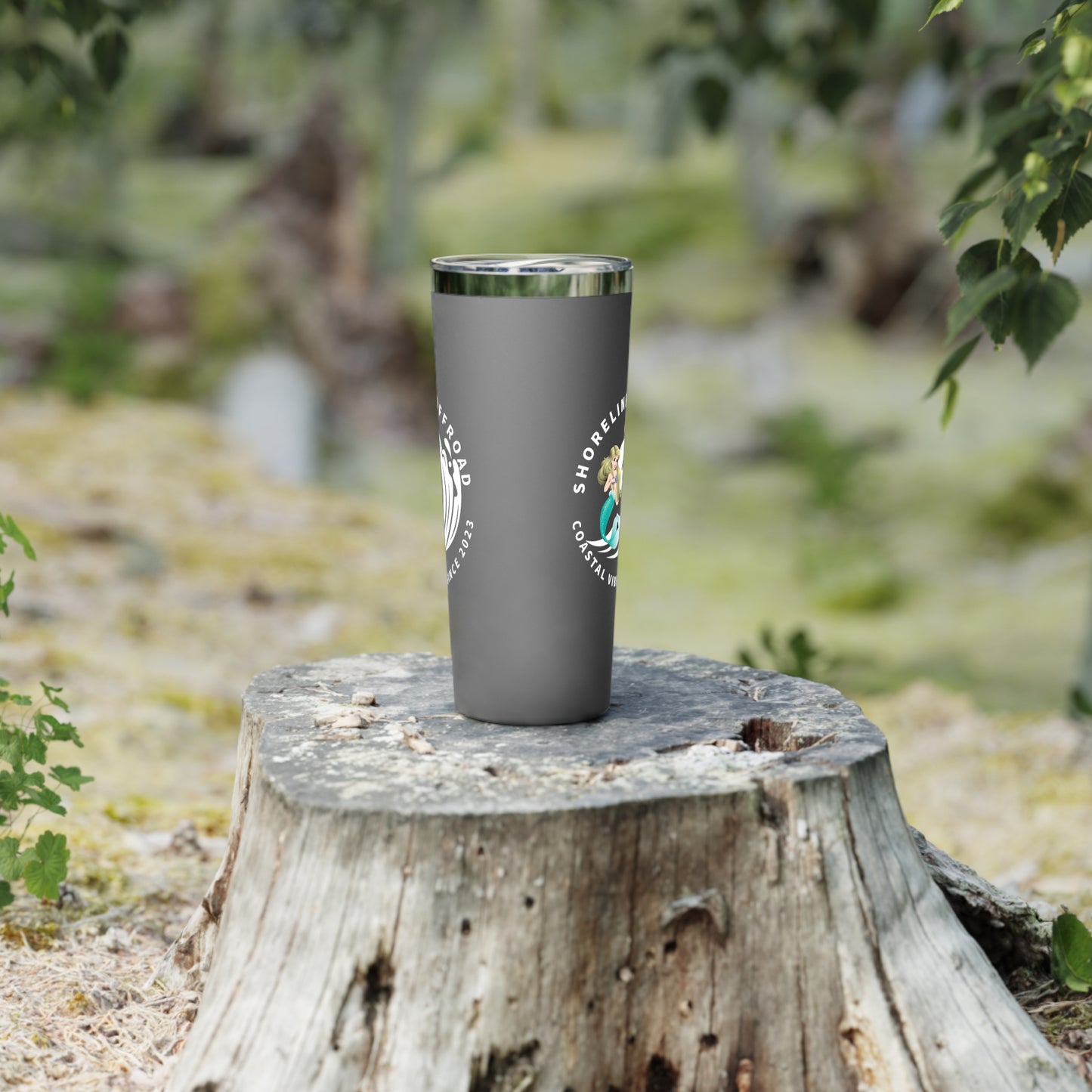 a cup sitting on top of a tree stump