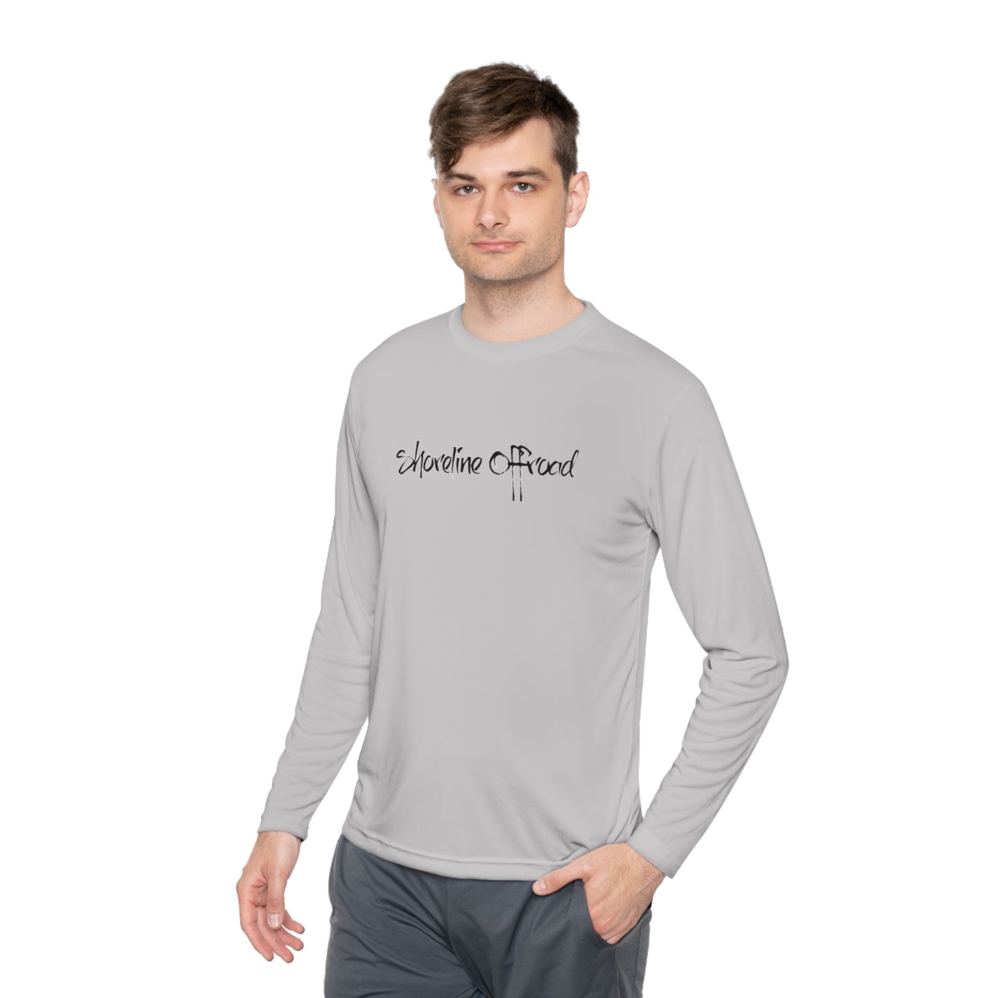 a man wearing a gray shirt with a black lettering on it