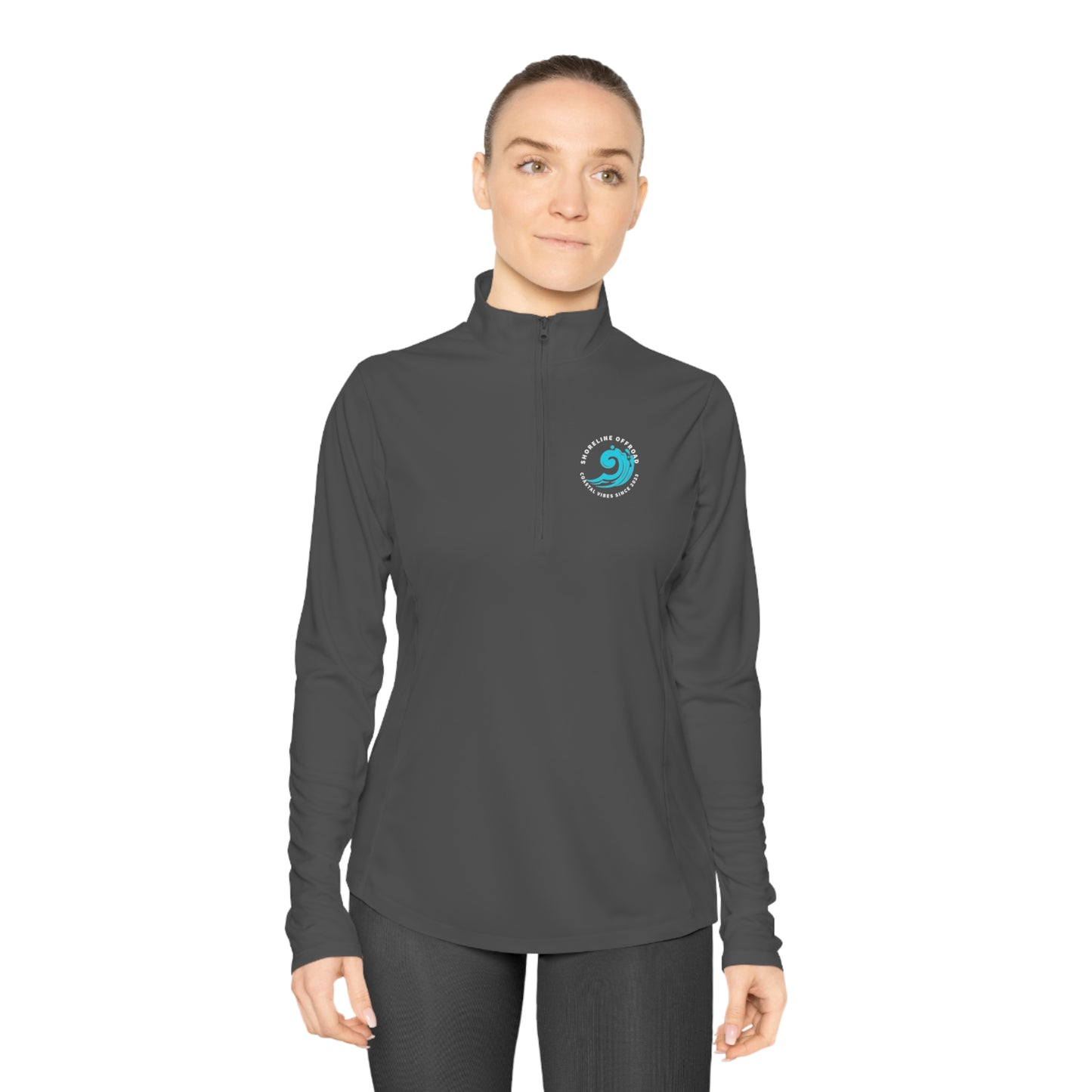 a woman wearing a black top with a logo on it
