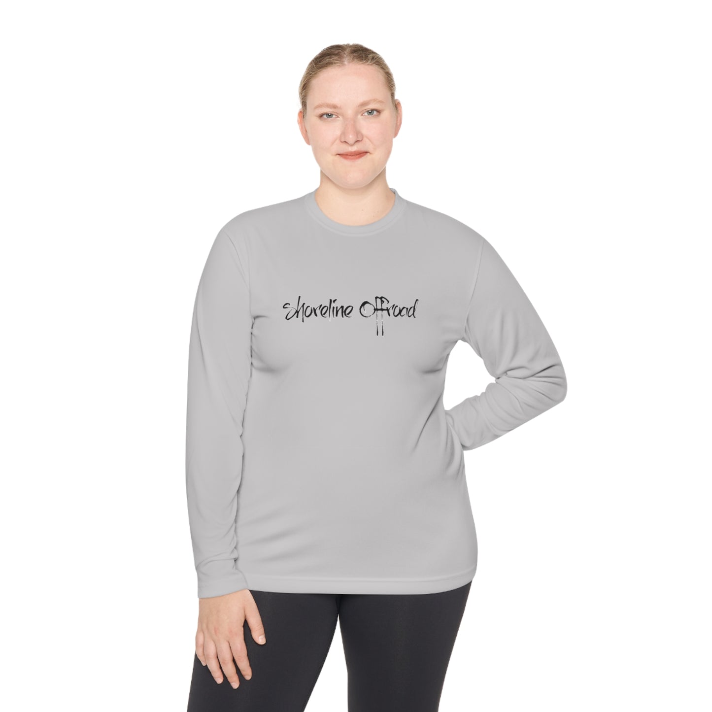 a woman wearing a gray shirt with the words welcome to chaos on it