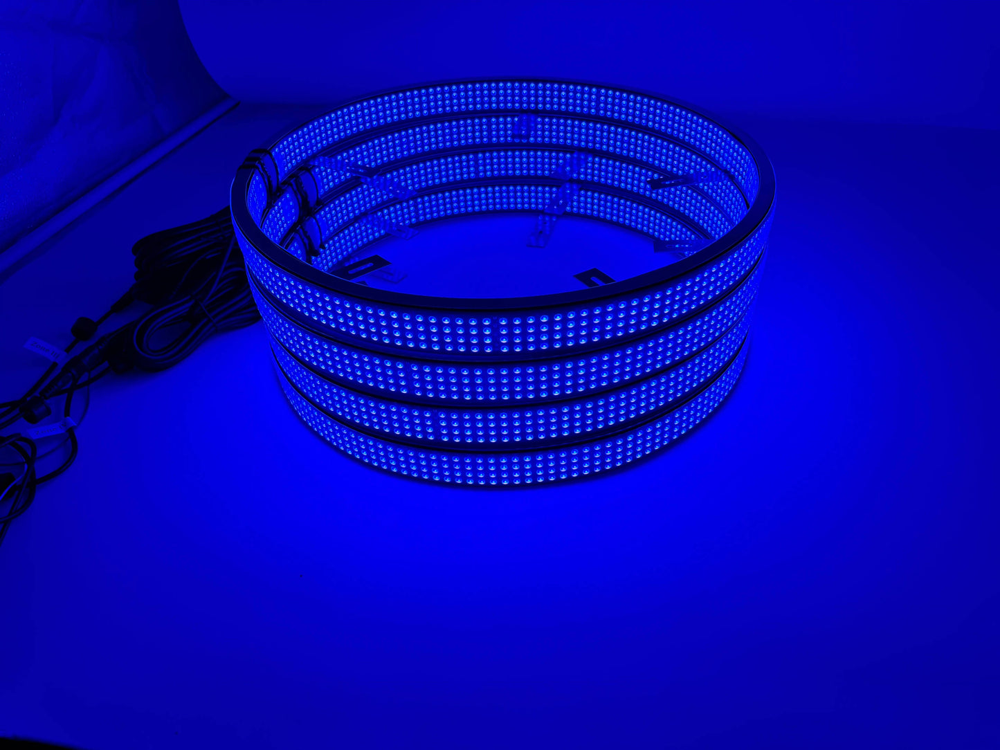a stack of blue lights sitting on top of a table