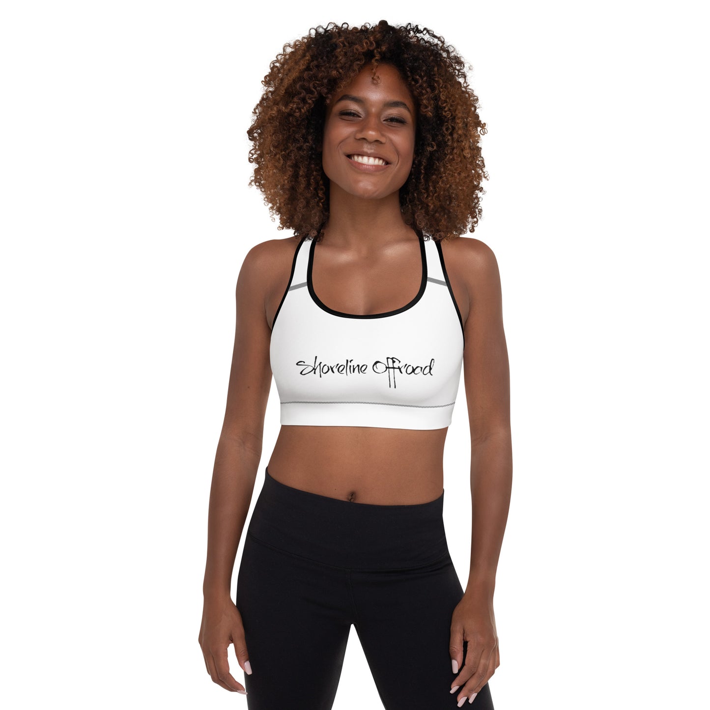 a woman wearing a white sports bra top