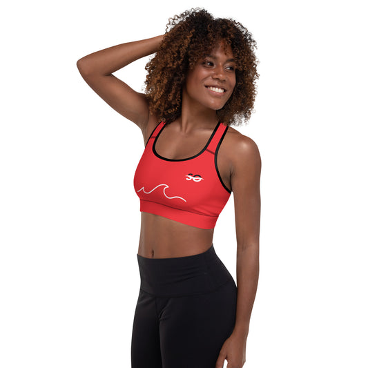a woman wearing a red sports bra top