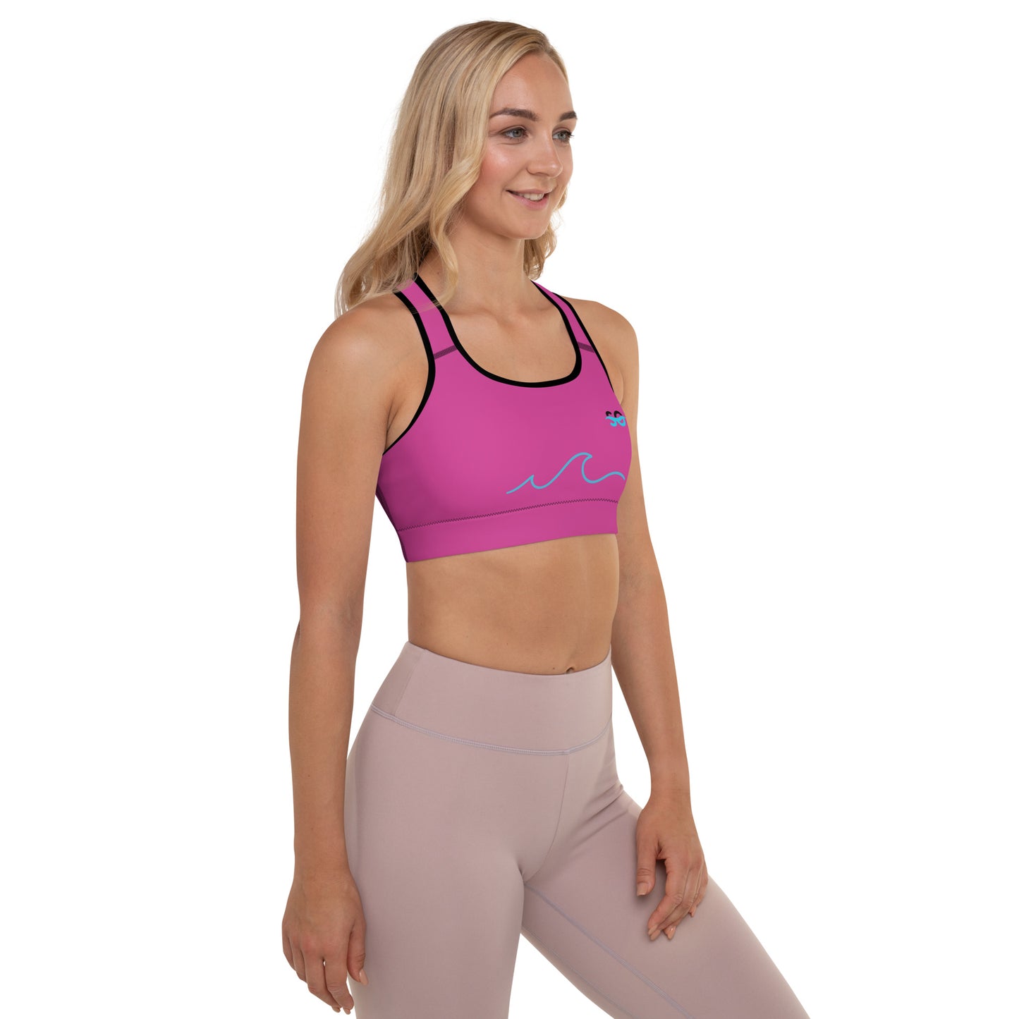 a woman in a pink sports bra top and leggings