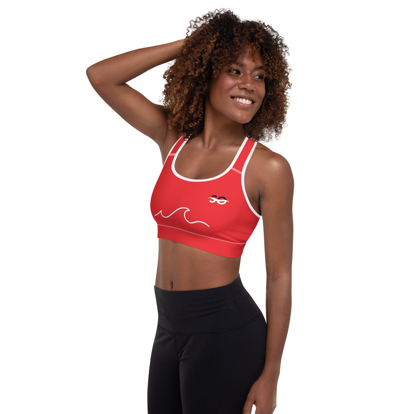 a woman wearing a red sports bra top