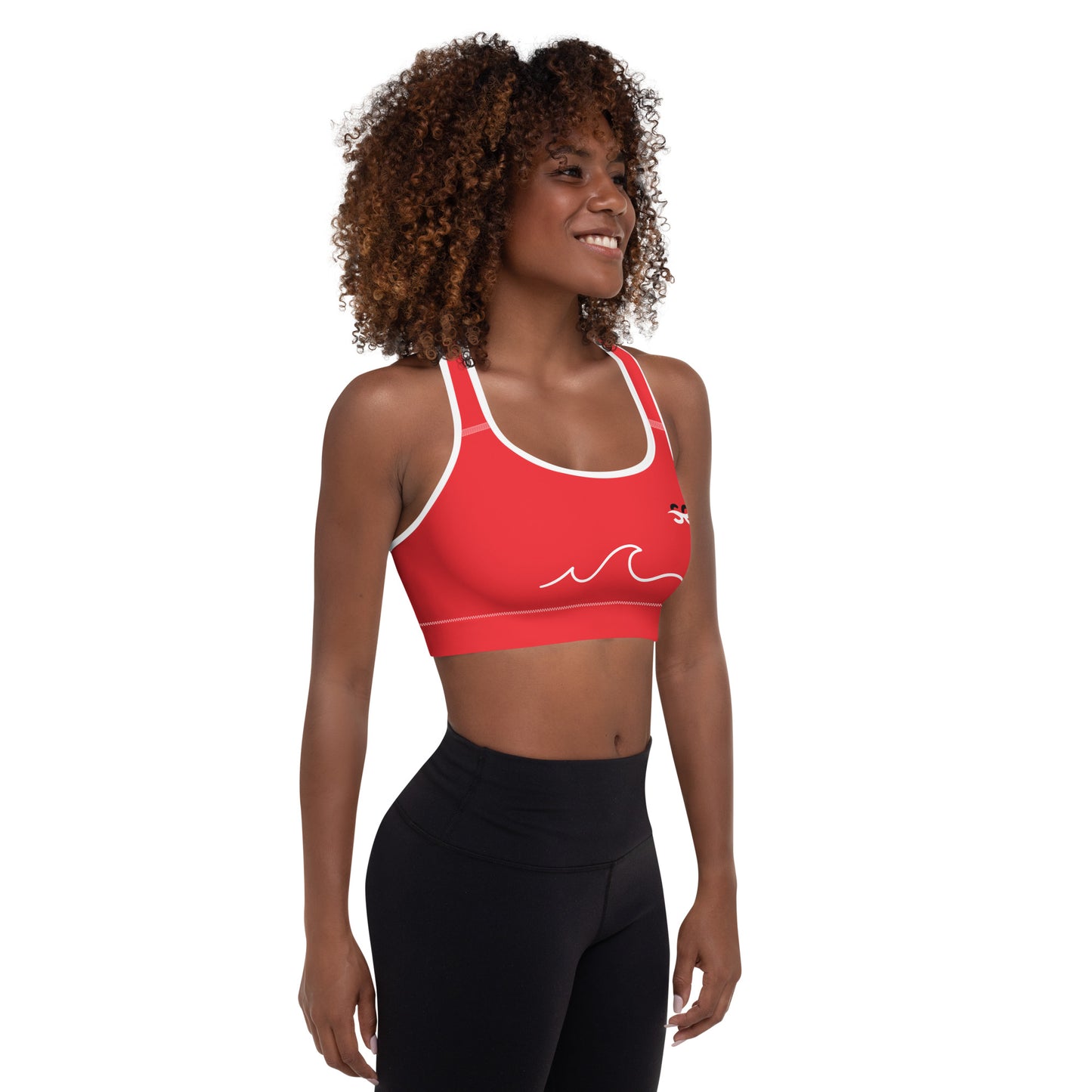 a woman wearing a red sports bra top