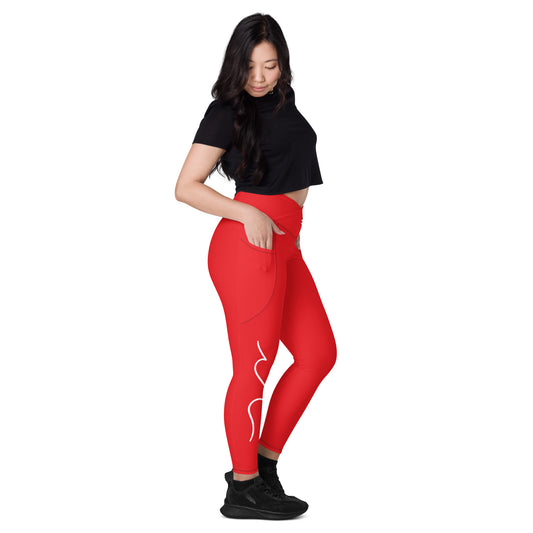 a woman in a black top and red leggings