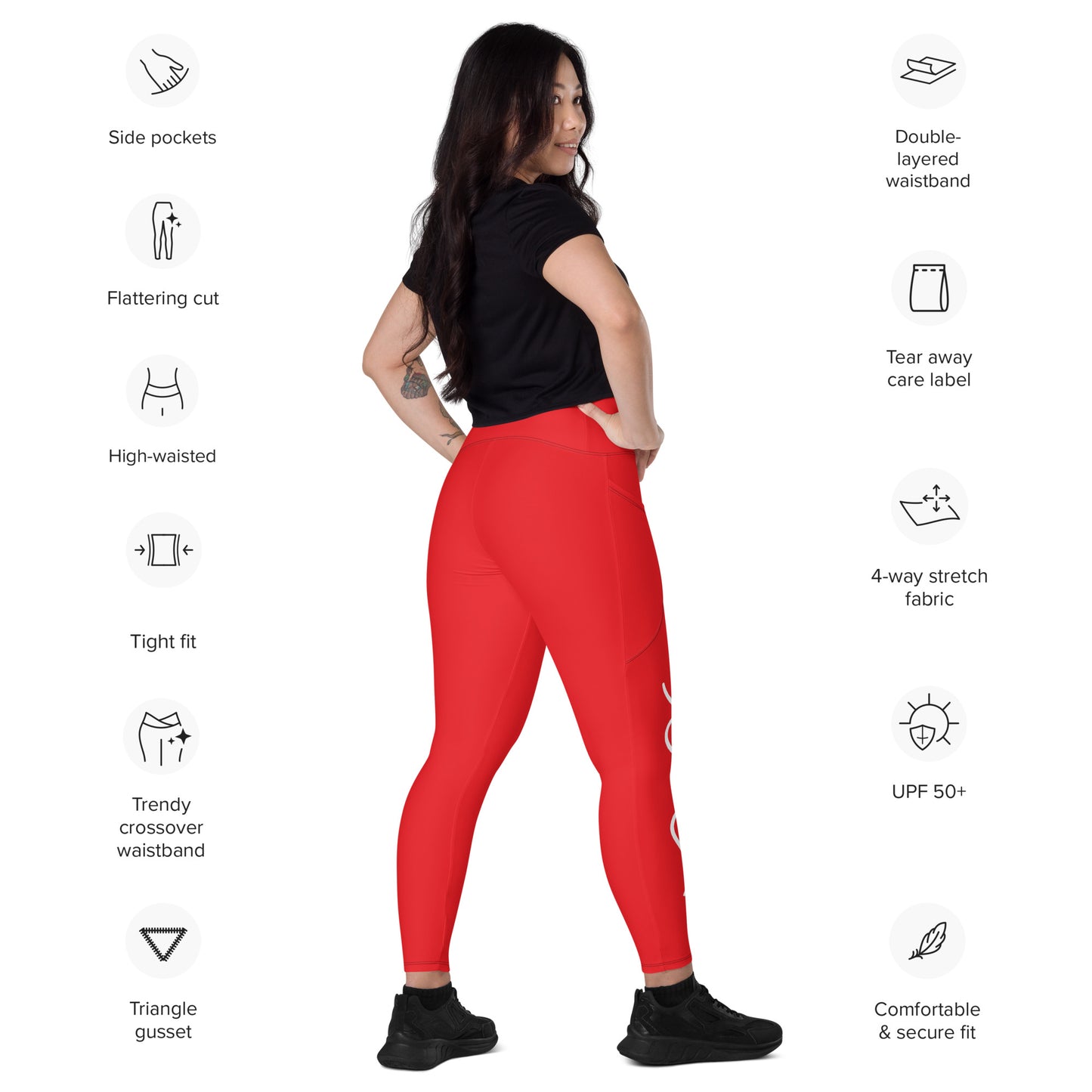 a woman in a black top and red leggings