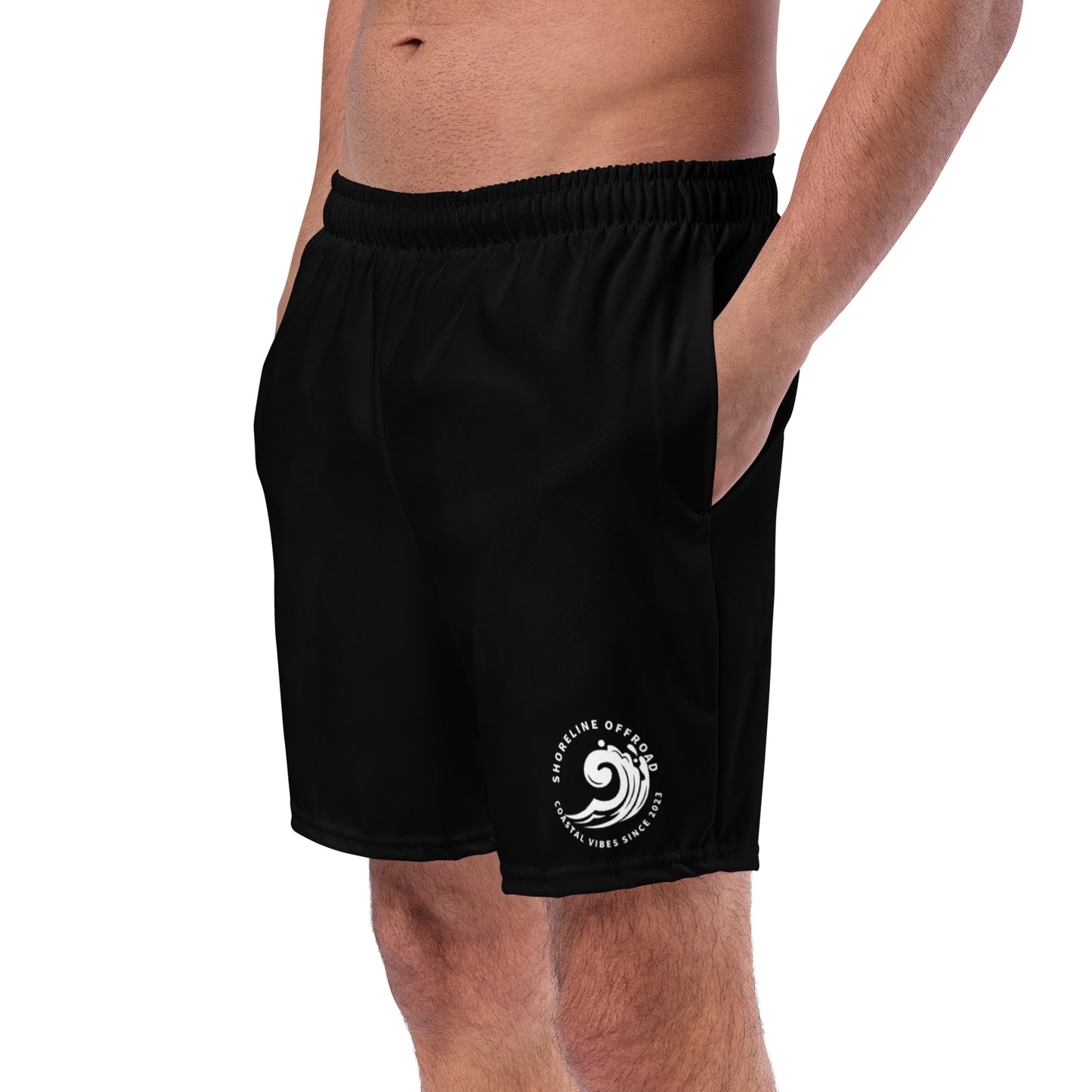 a man wearing a black shorts with a white logo