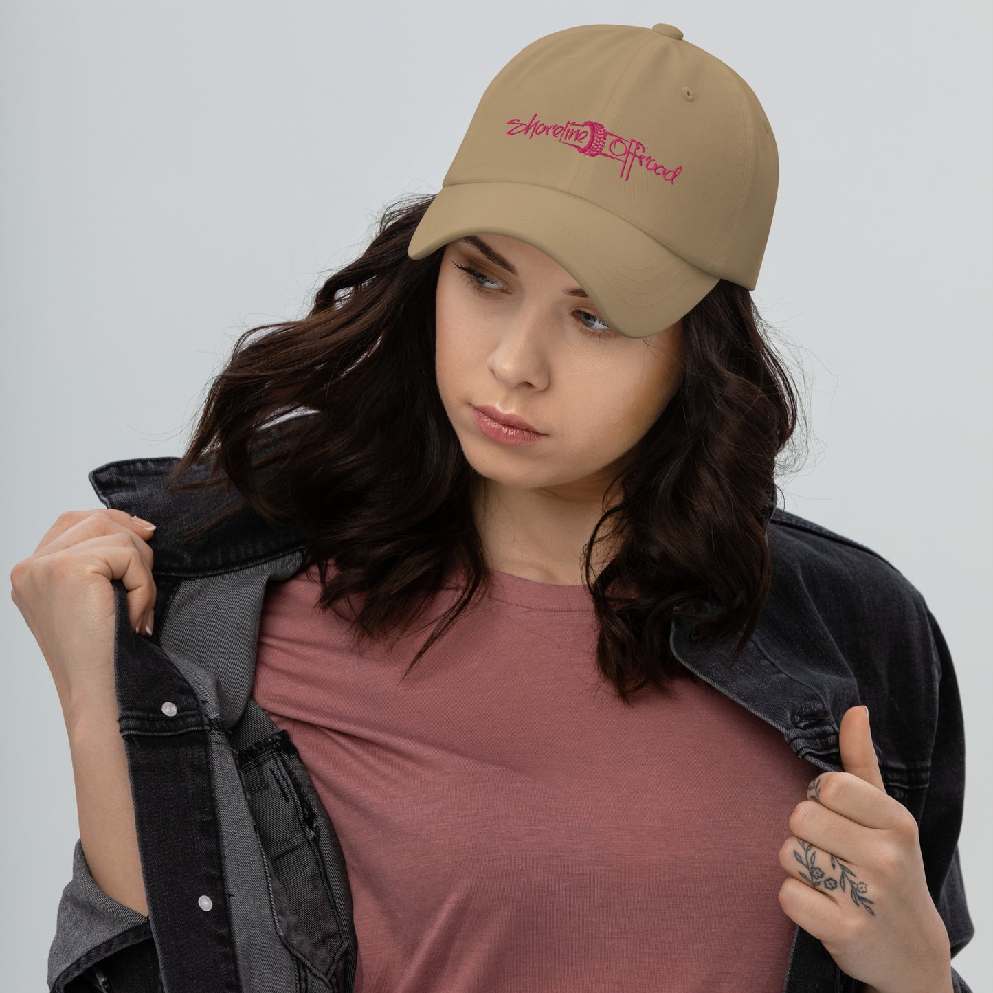 a woman wearing a hat and jacket
