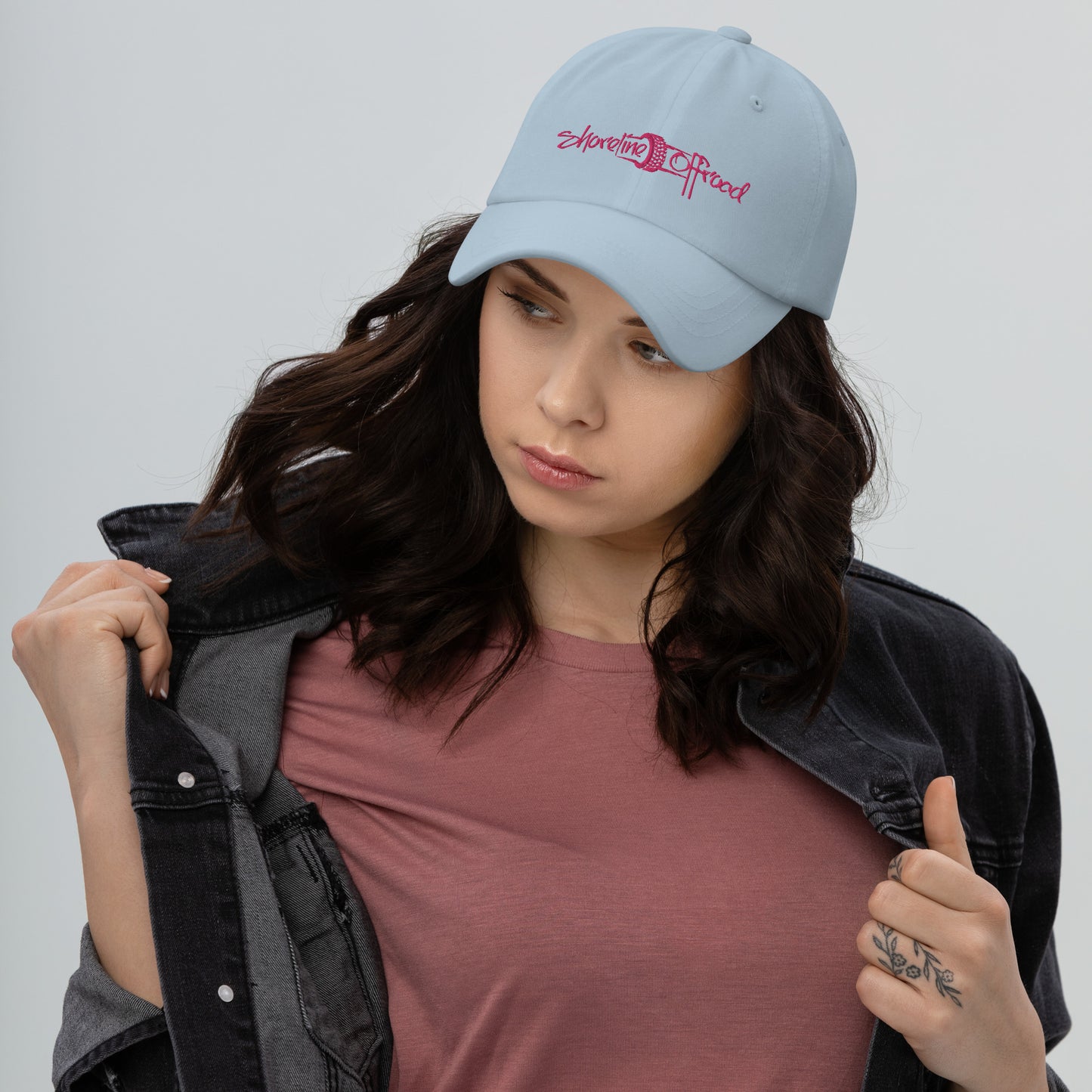 a woman wearing a blue hat and jacket