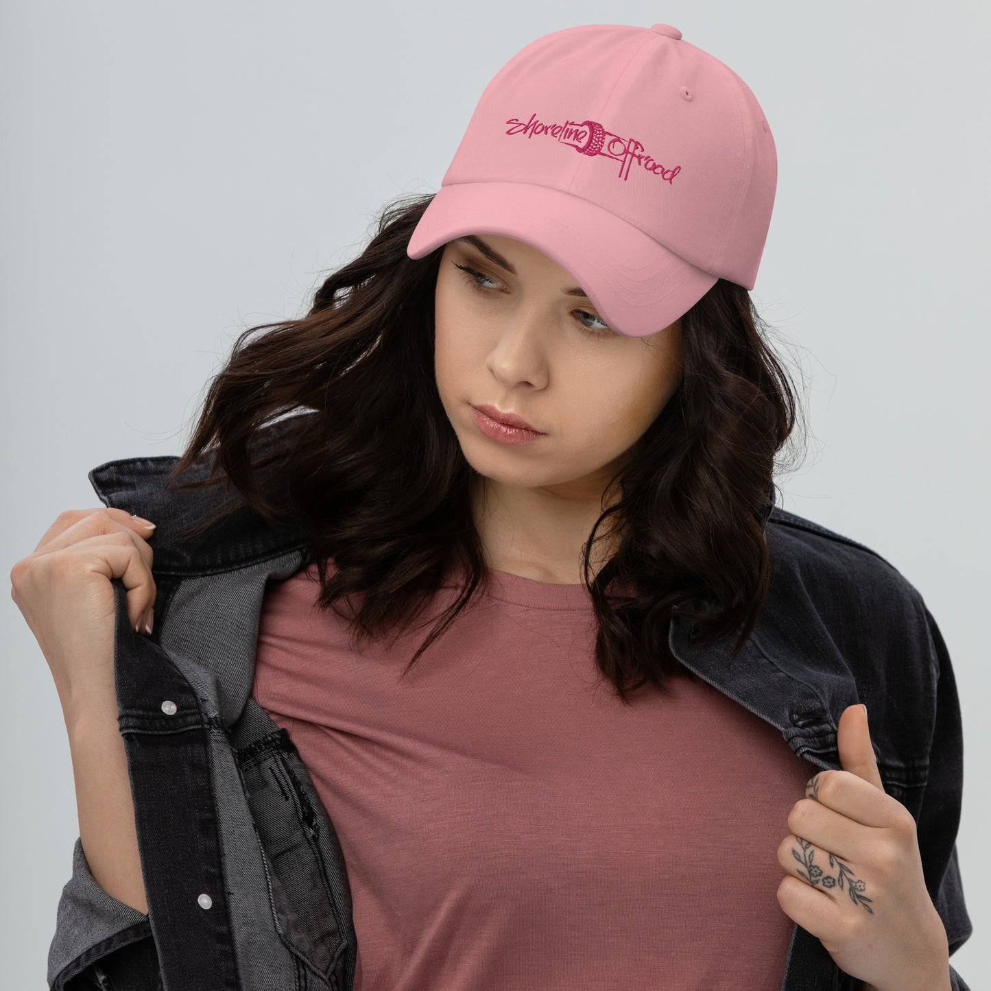 a woman wearing a pink hat and jacket