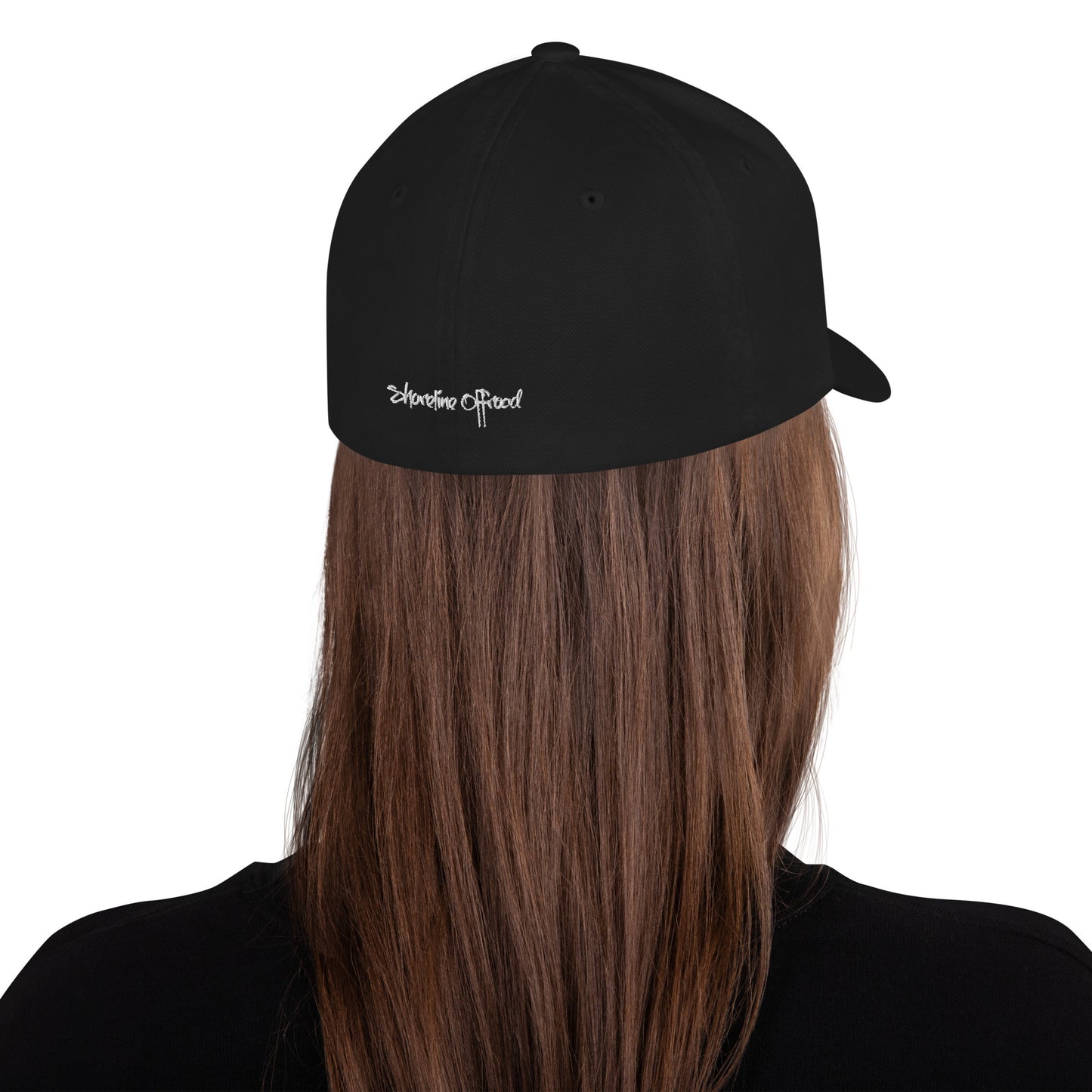 a woman with long hair wearing a black hat