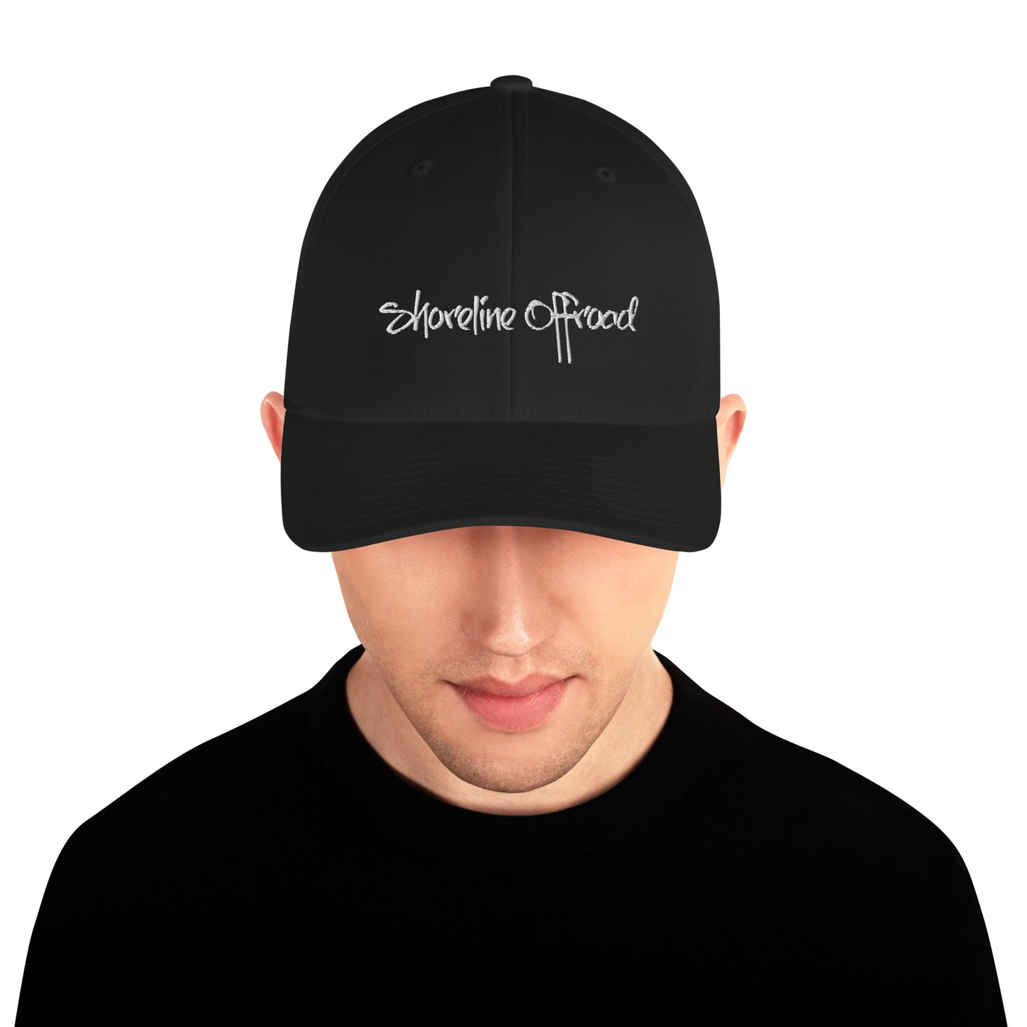 a man wearing a black hat with white writing on it