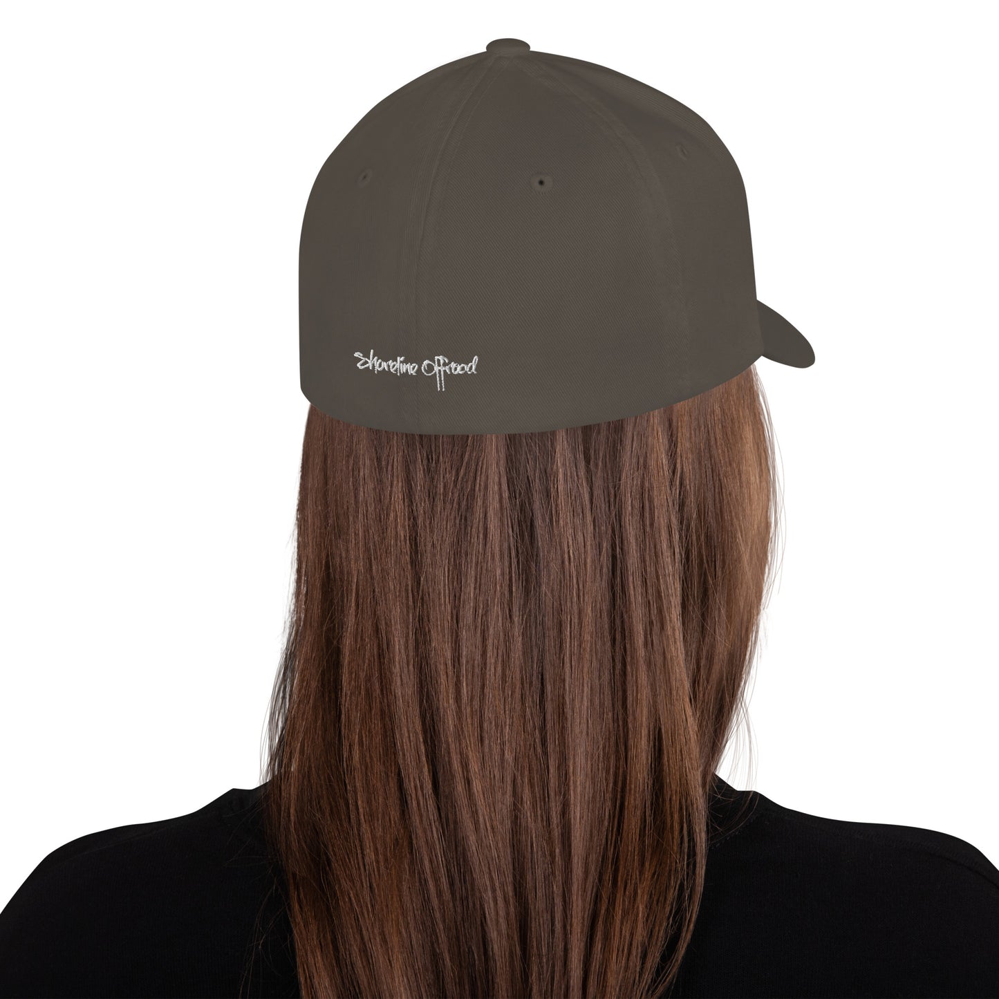 a person with long hair wearing a hat