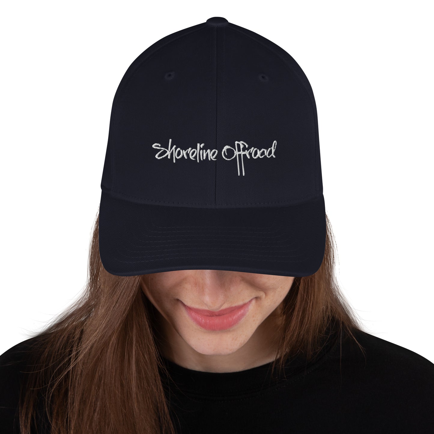 a woman wearing a black hat with white writing on it
