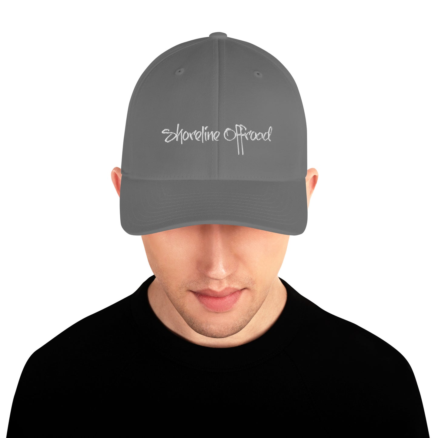 a man wearing a gray hat with the words shoreline proud on it