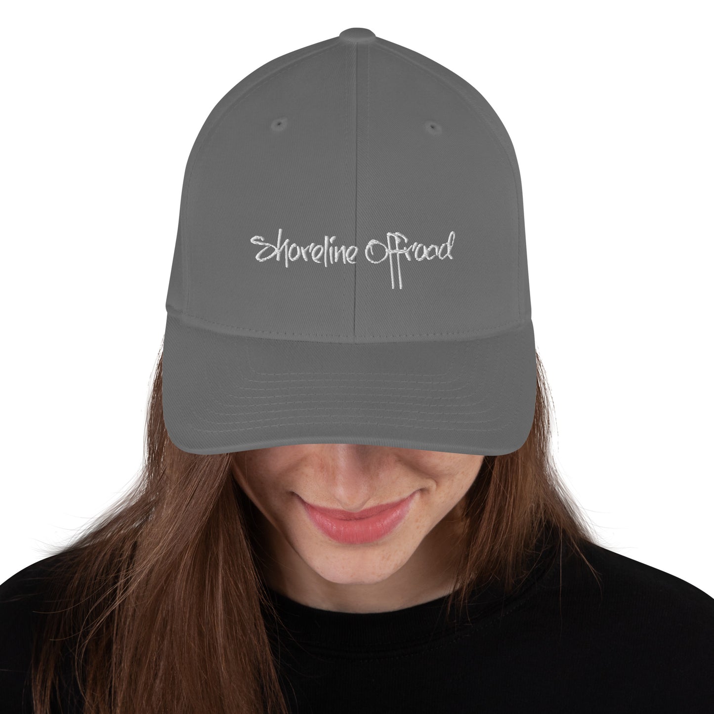 a woman wearing a gray hat with white lettering