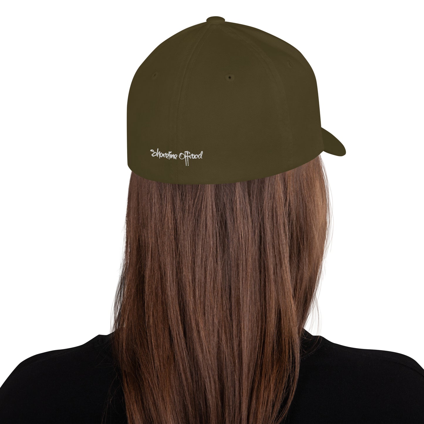 a woman with long hair wearing a green hat