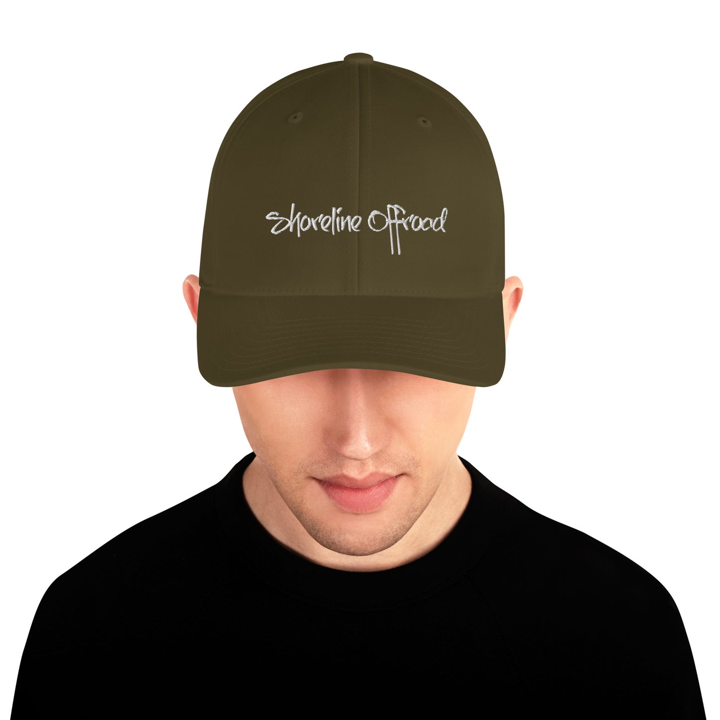a man wearing a green hat with the words shoreline road on it