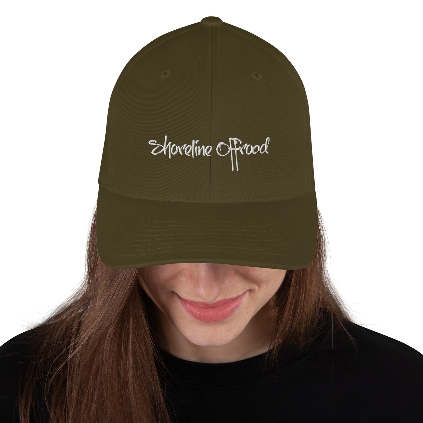 a woman wearing a hat with the words shoreline offroad on it