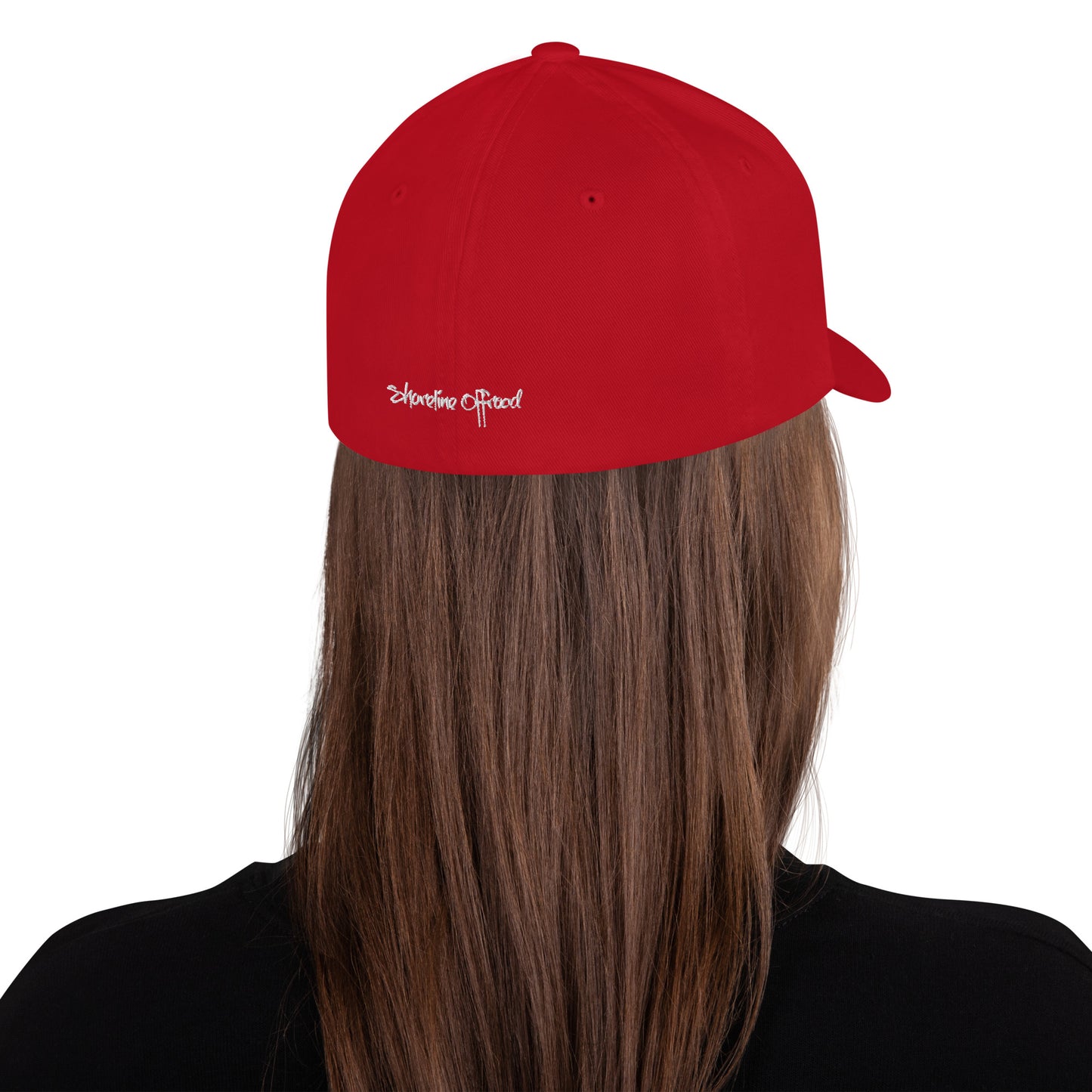 a woman with long hair wearing a red hat