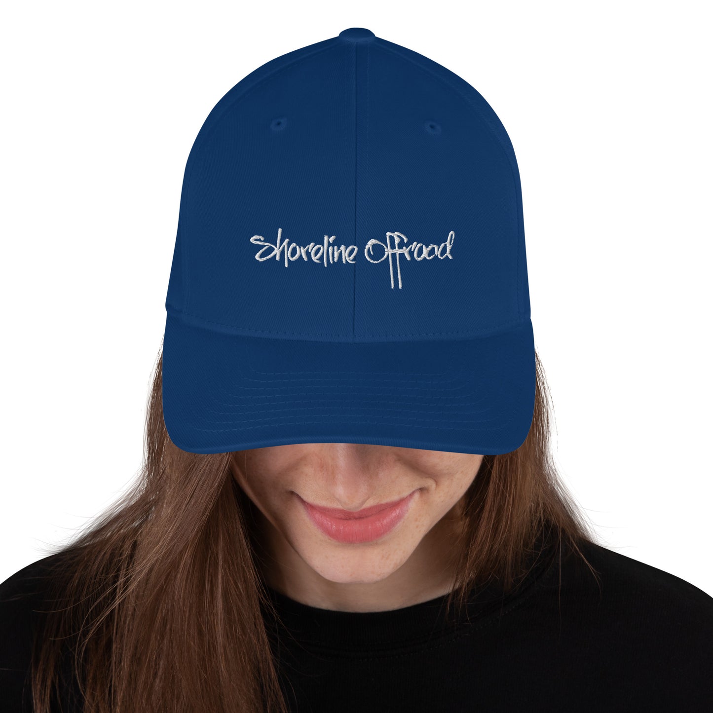 a woman wearing a blue hat with the words shoreline road on it
