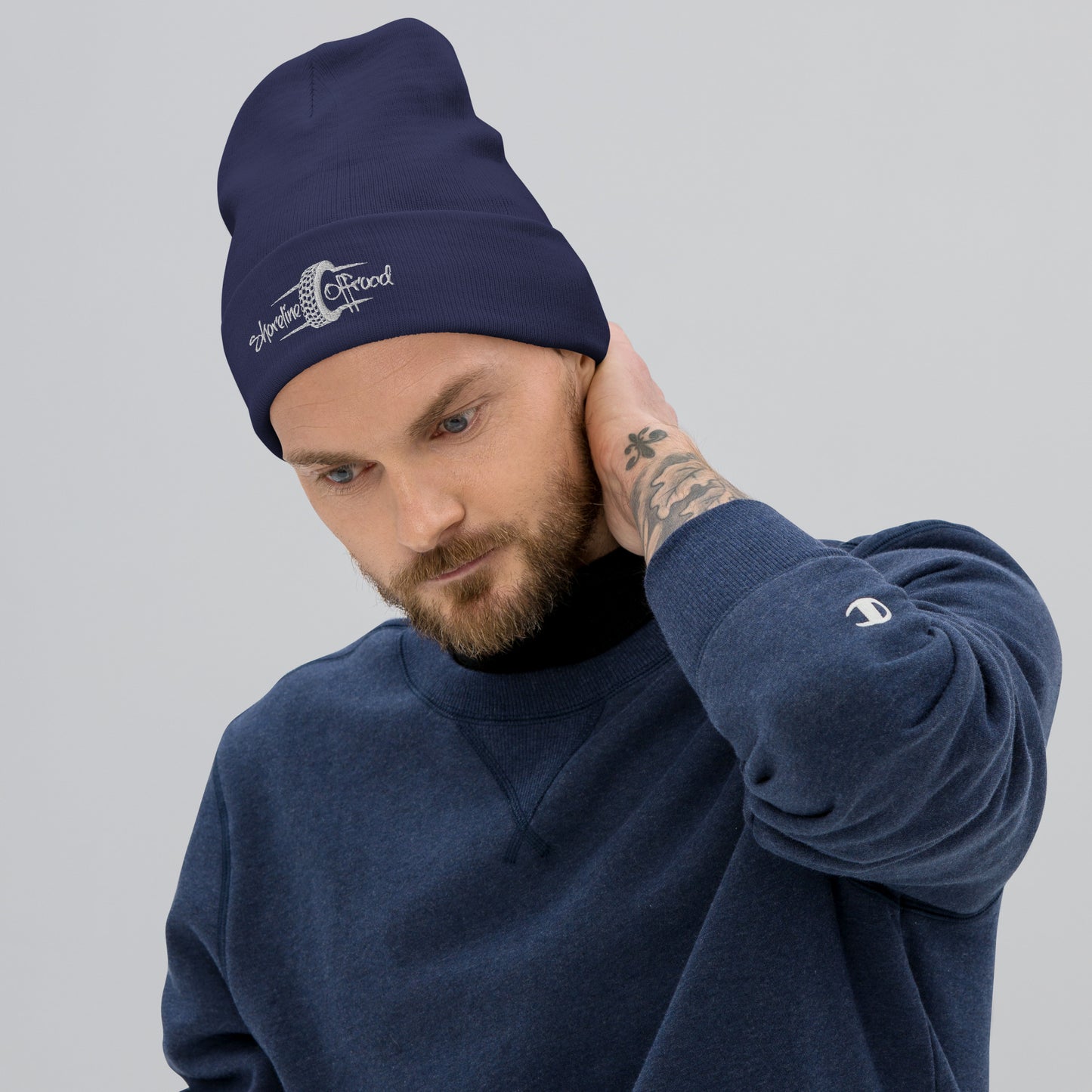 a man with a beard wearing a beanie