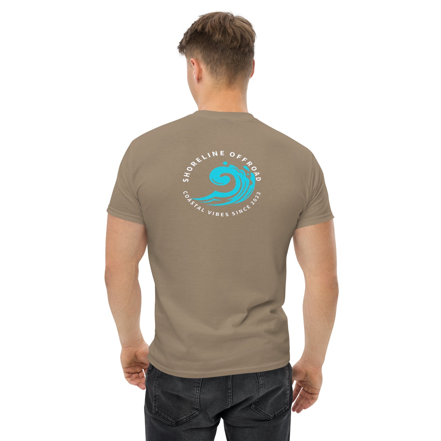 a man wearing a brown t - shirt with a blue wave on it