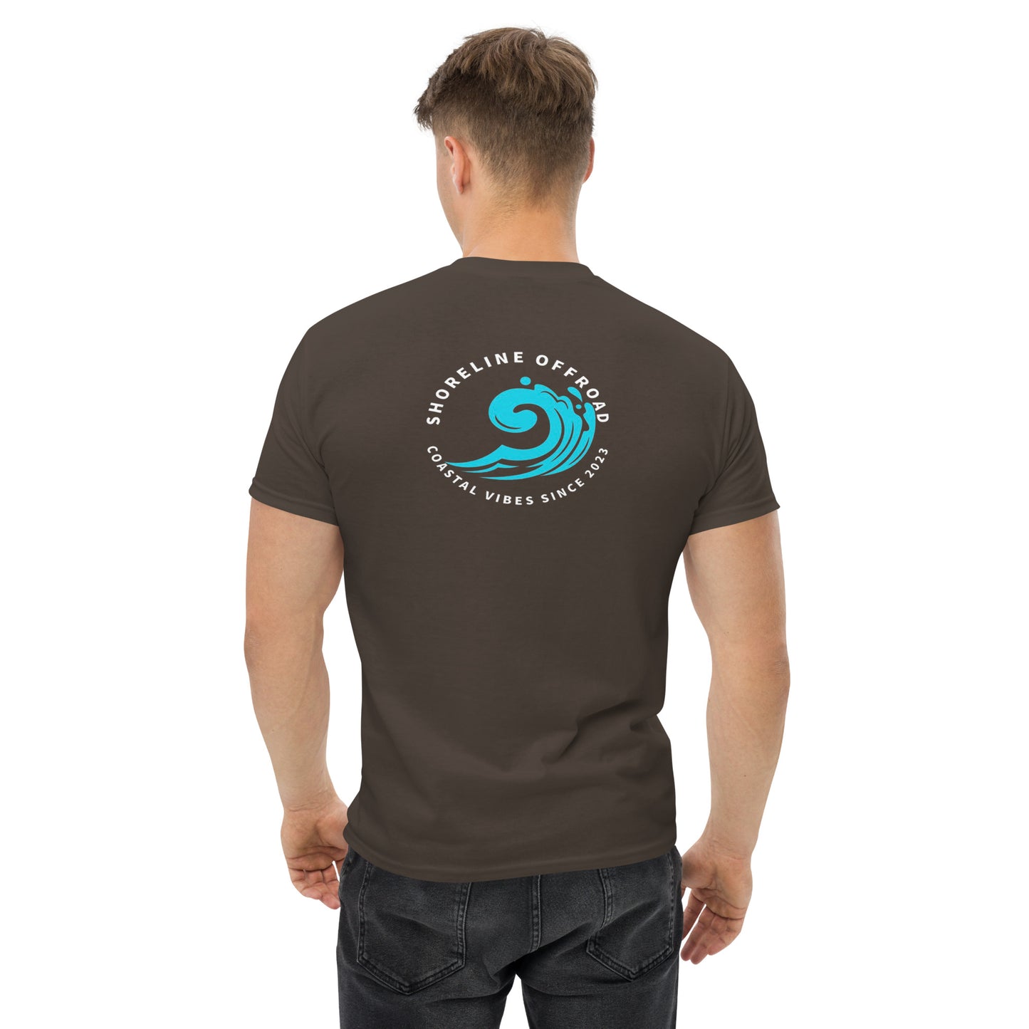 a man wearing a brown t - shirt with a blue wave on it