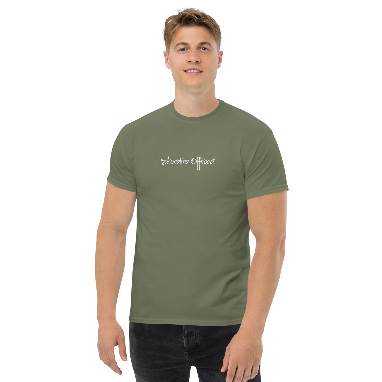 a man wearing a green t - shirt with the words, somewhere is beyond