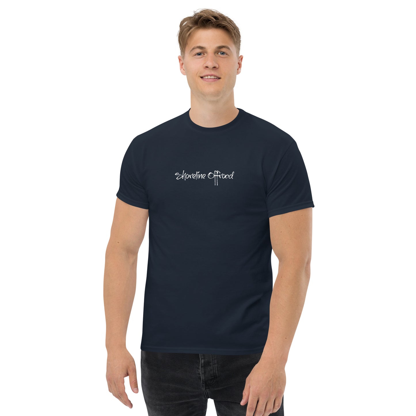 a man wearing a blue t - shirt with the words, somewhere is beyond
