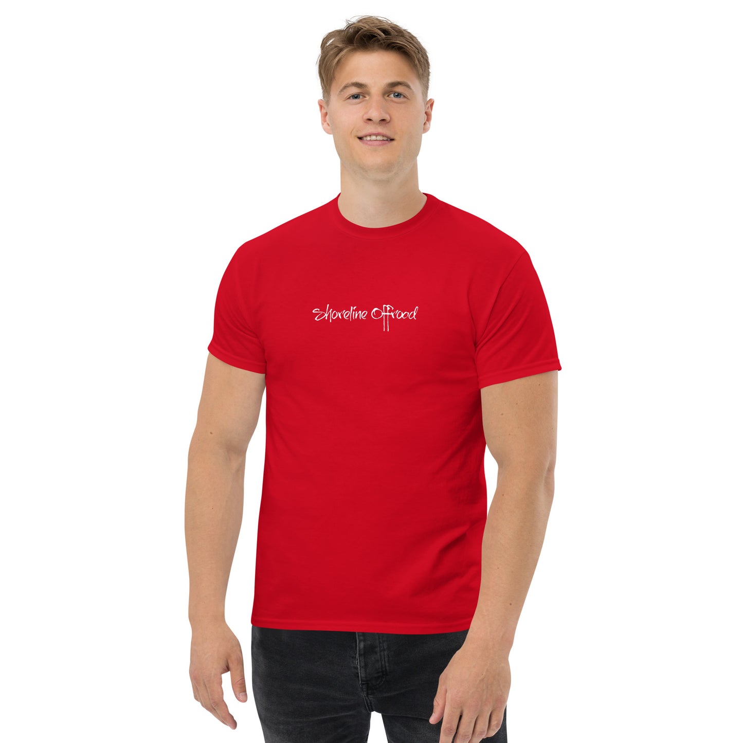 a man wearing a red t - shirt with a white logo