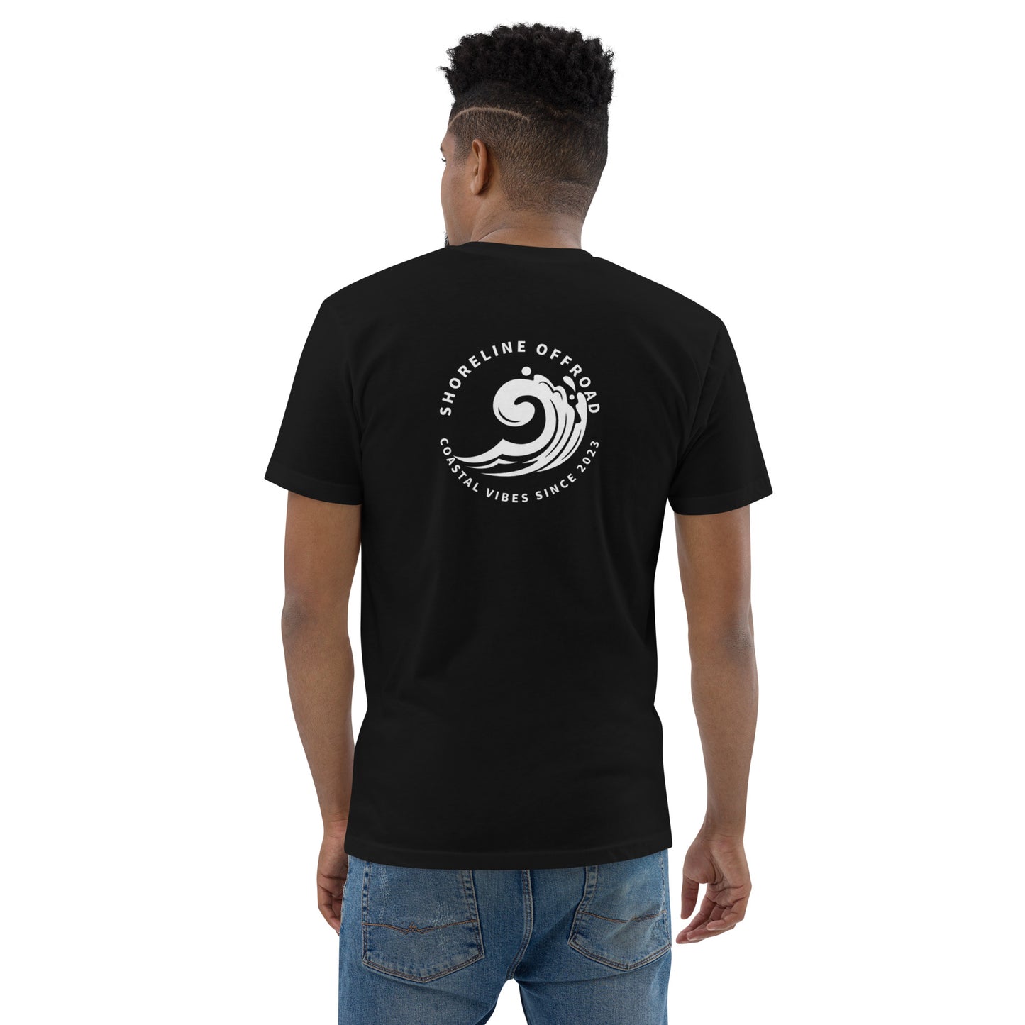 a man wearing a black t - shirt with a white logo