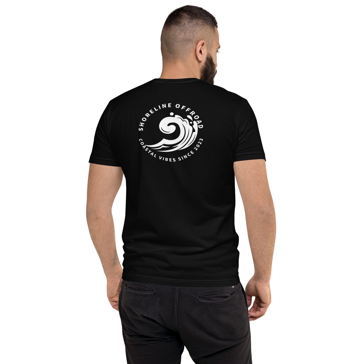 a man wearing a black t - shirt with a white logo