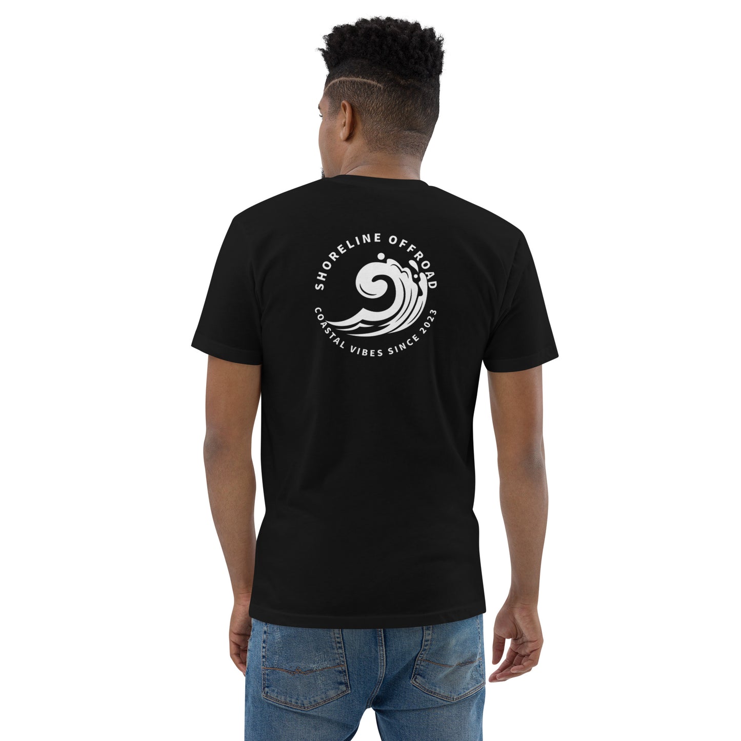 a man wearing a black t - shirt with a white logo