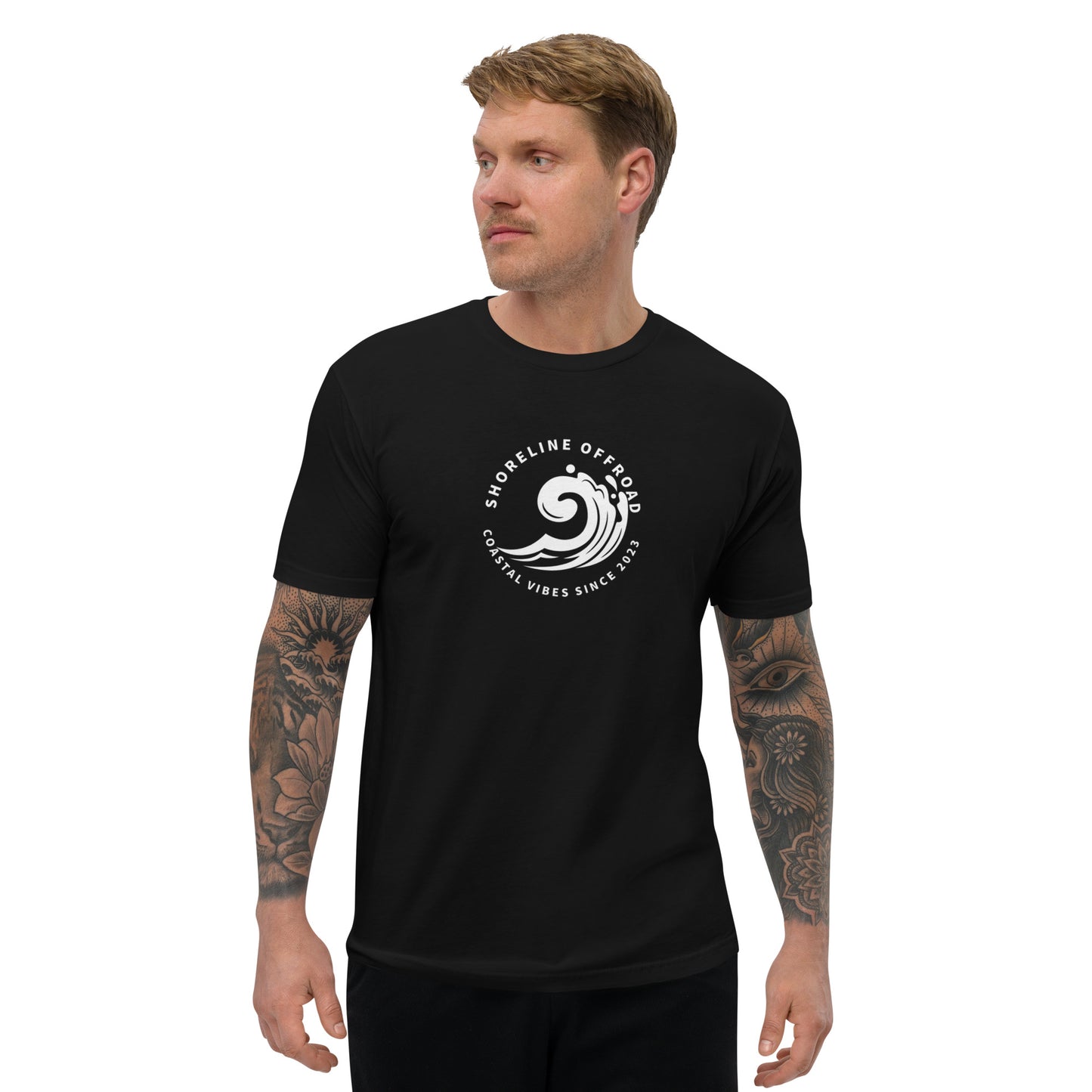 a man wearing a black t - shirt with a white logo