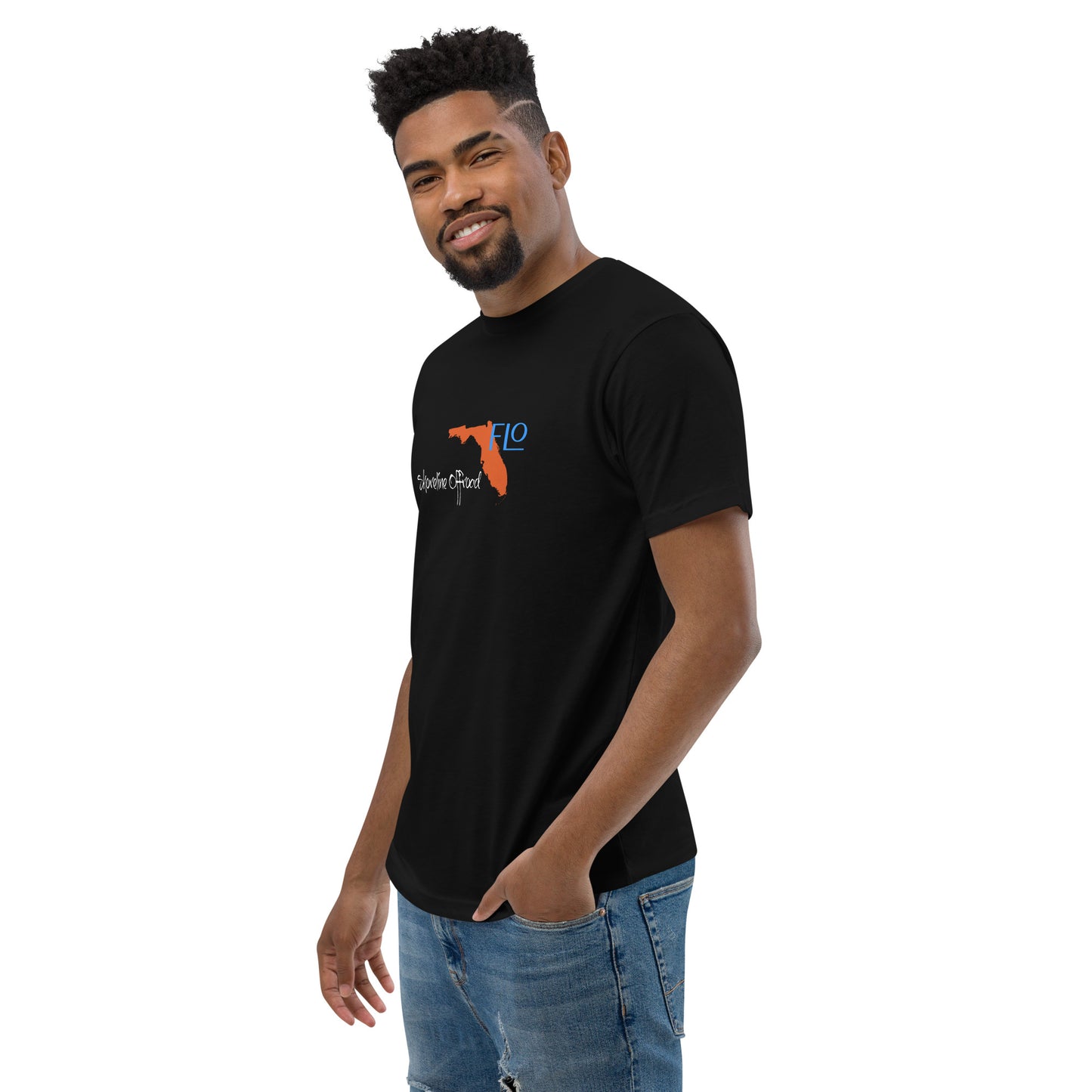 a man wearing a black t - shirt and jeans