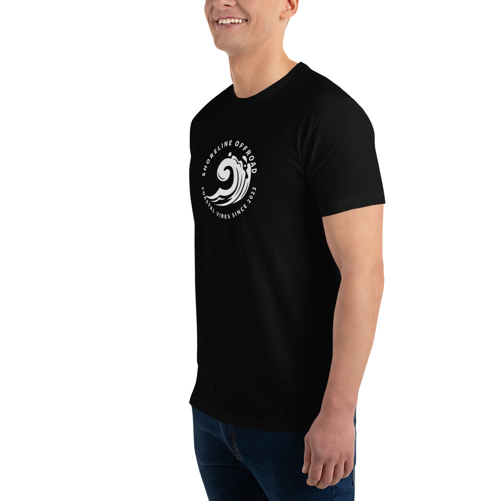 a man wearing a black t - shirt with a white wave on it