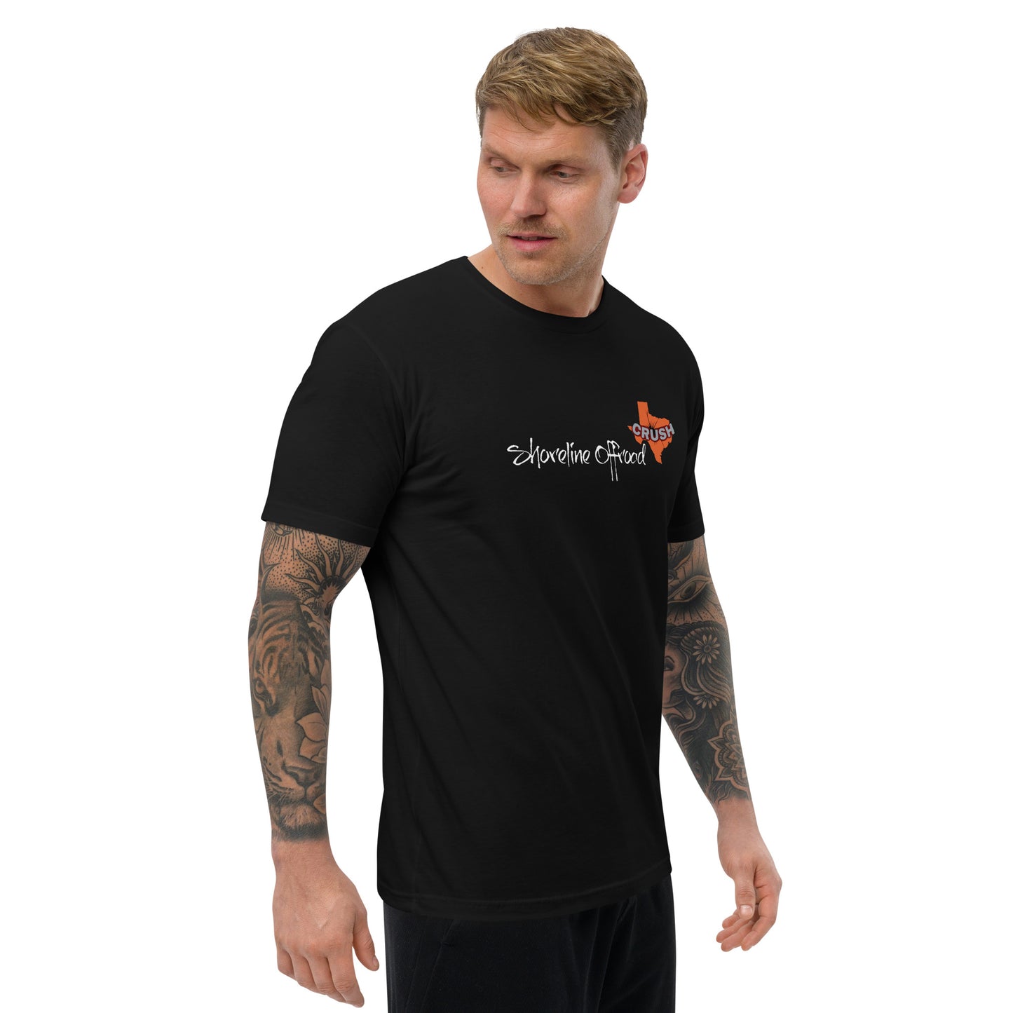 a man wearing a black shirt with a tattoo on his arm