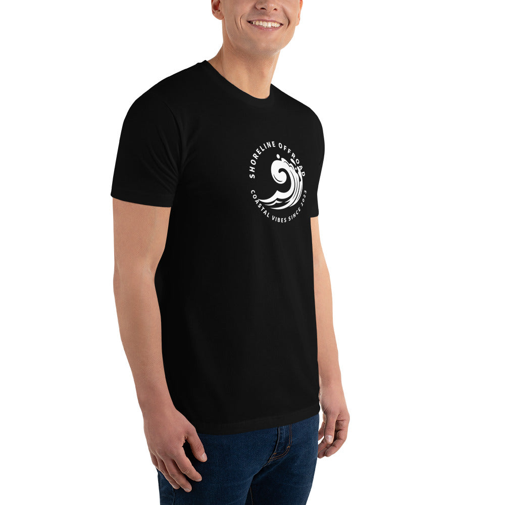 a man wearing a black t - shirt with a white logo