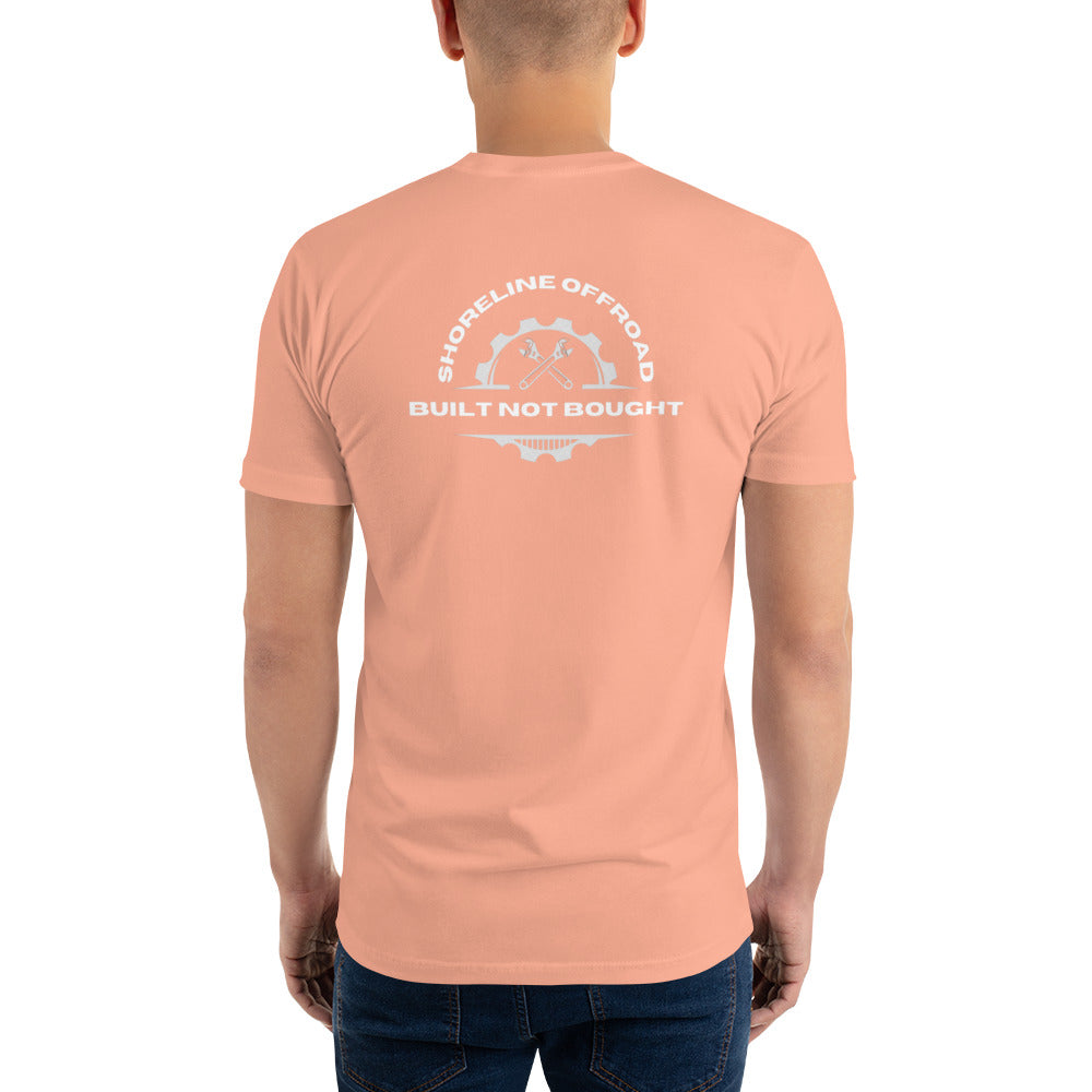 a man wearing a peach colored t - shirt with a white logo