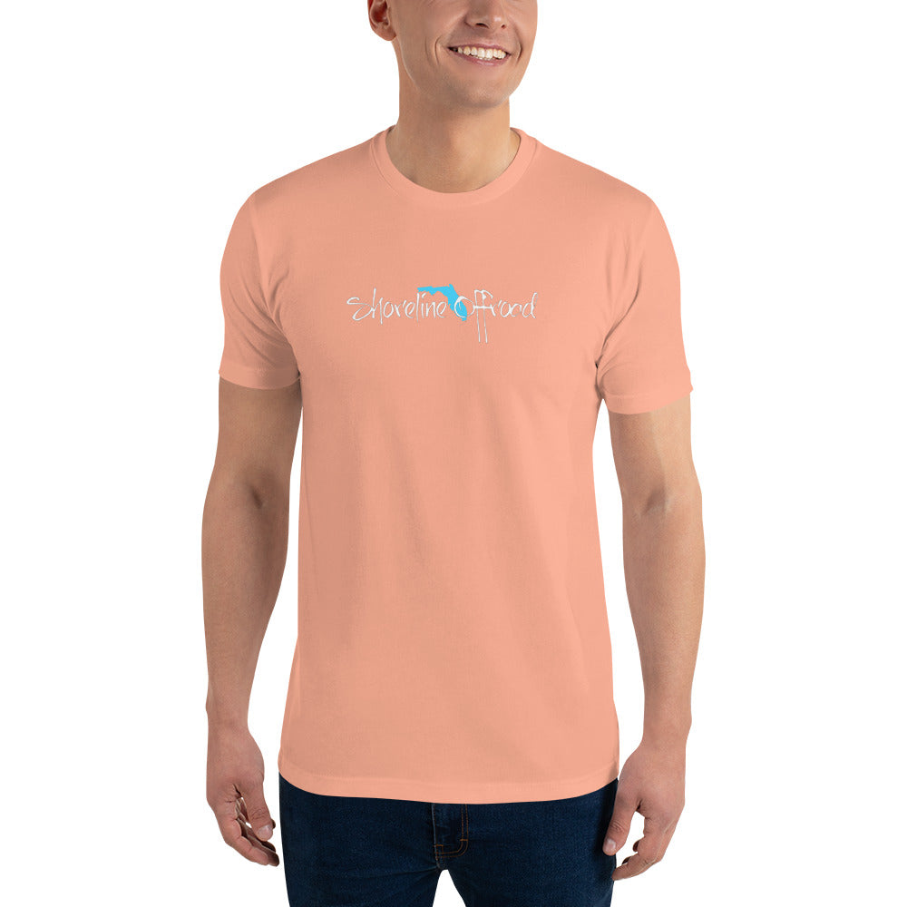 a man wearing a pink shirt with a blue logo on it