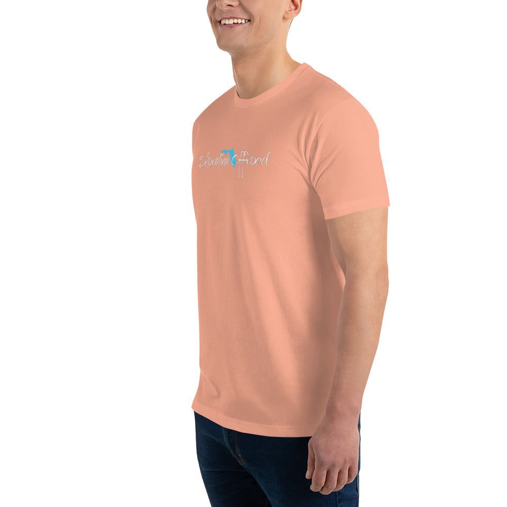 a man in a pink shirt smiles at the camera