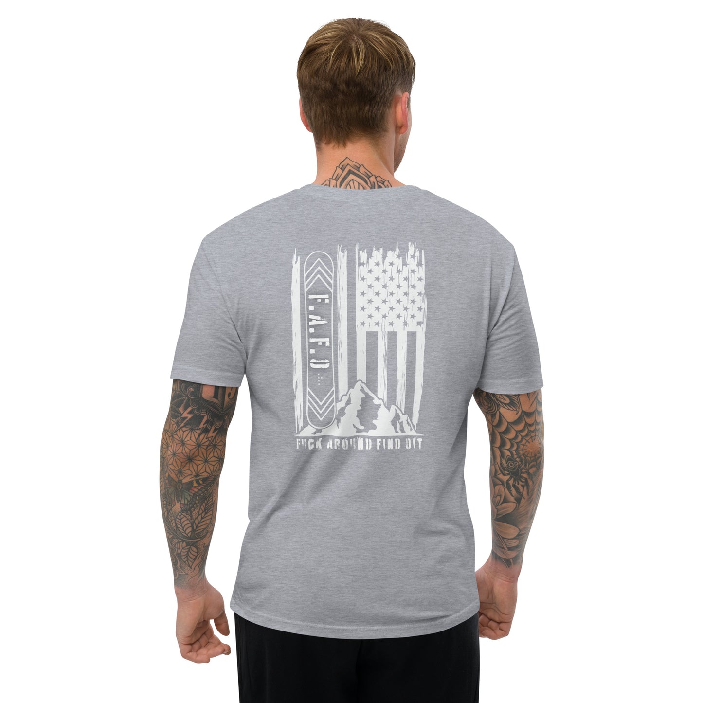 a man wearing a grey shirt with an american flag on it
