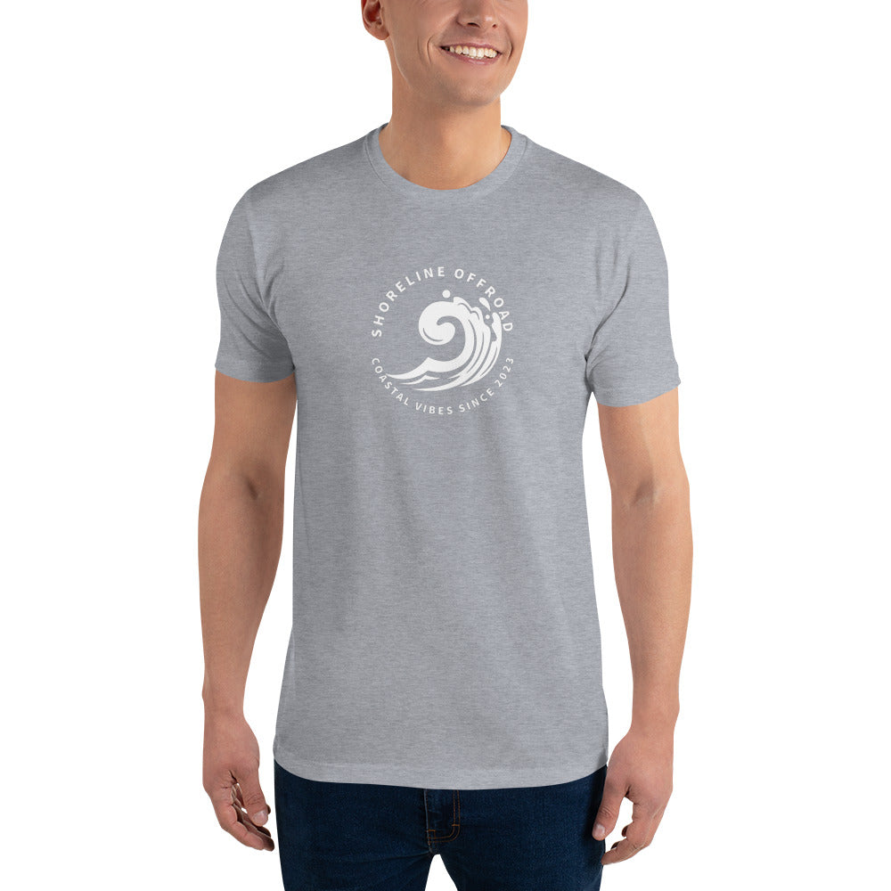 a man wearing a grey t - shirt with a white wave on it